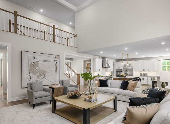 Modern open-concept Heartland Homes living room and kitchen with high ceilings